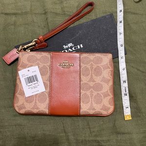 New coach signature large wristlet in color tan rust